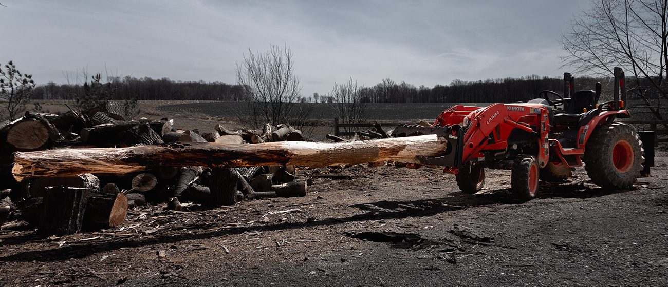 Split-fire Buck-it XL mounted on kubota tractor