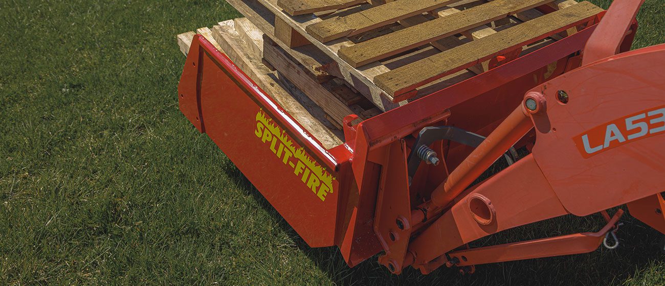 Split-Fire high cap bucket mounted to kubota bx with pallets loaded