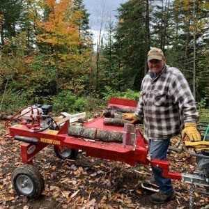 gas powered log splitter at wood lot