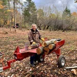 gas powered log splitter at wood lot
